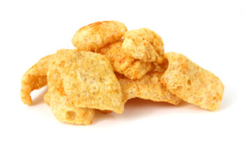 pile of pork rinds on white background