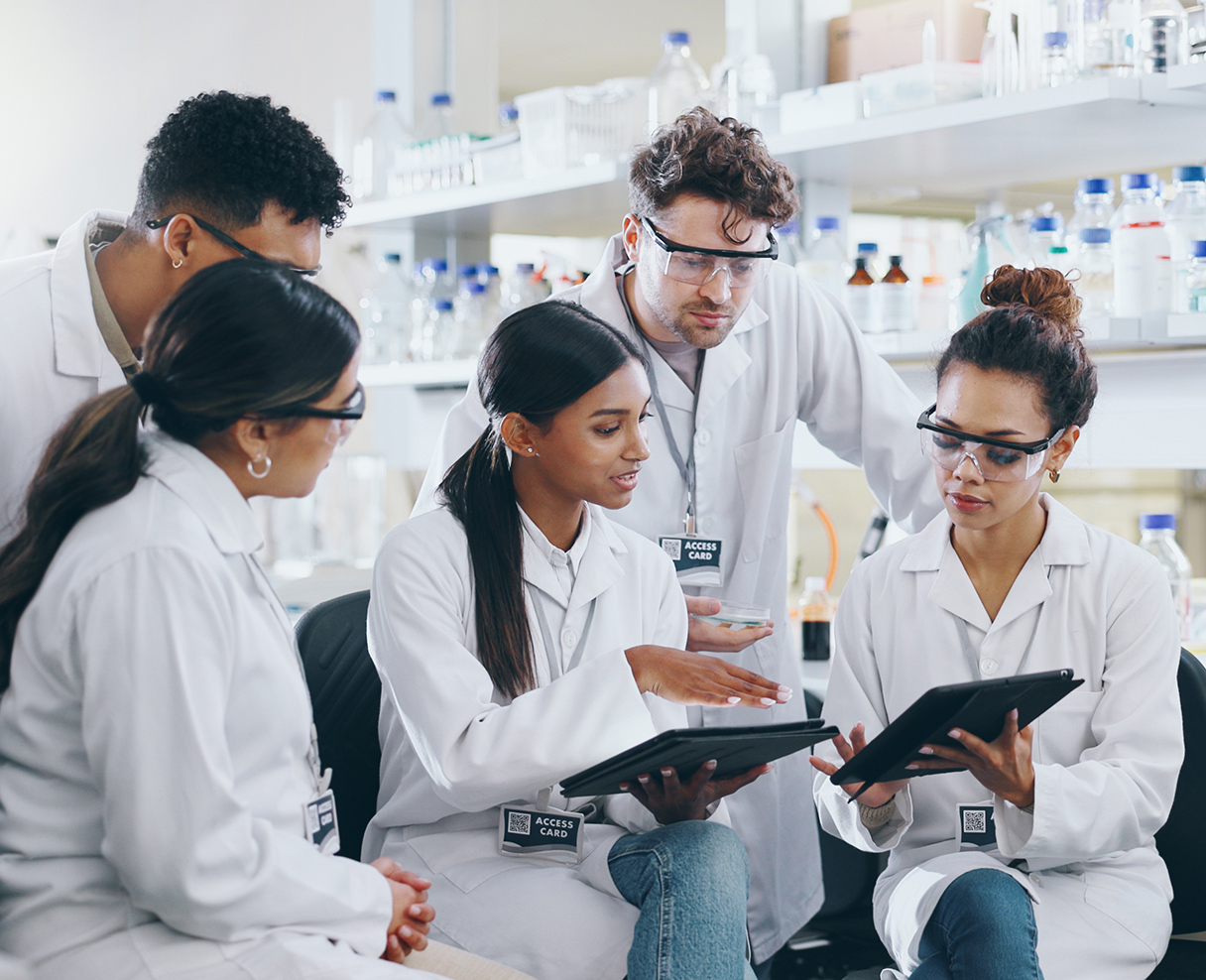 Tablet, science team and people learning for cancer cure, help or medical development in laboratory. Training, investigation or research info with scientists in clinical trial for medicine internship